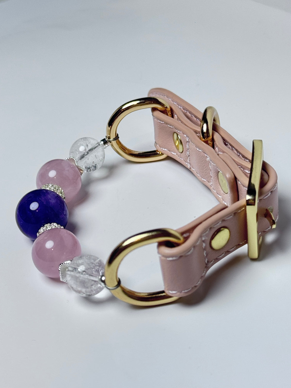Pink leather pet collar with polished gold-tone buckle and hardware