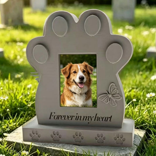 Personalized paw print pet memorial with dog photo in a garden