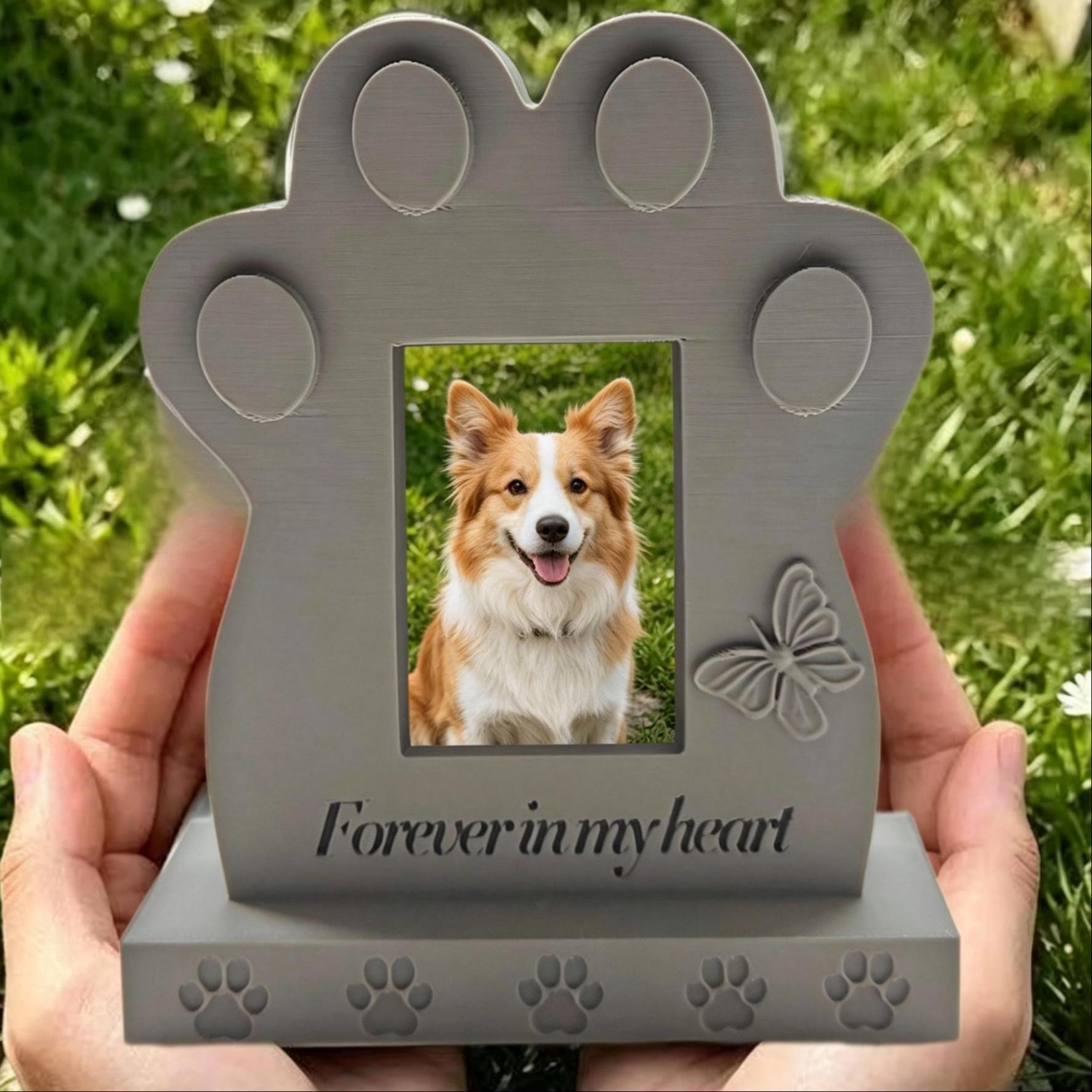 Close view of personalized dog memorial photo frame held in two hands