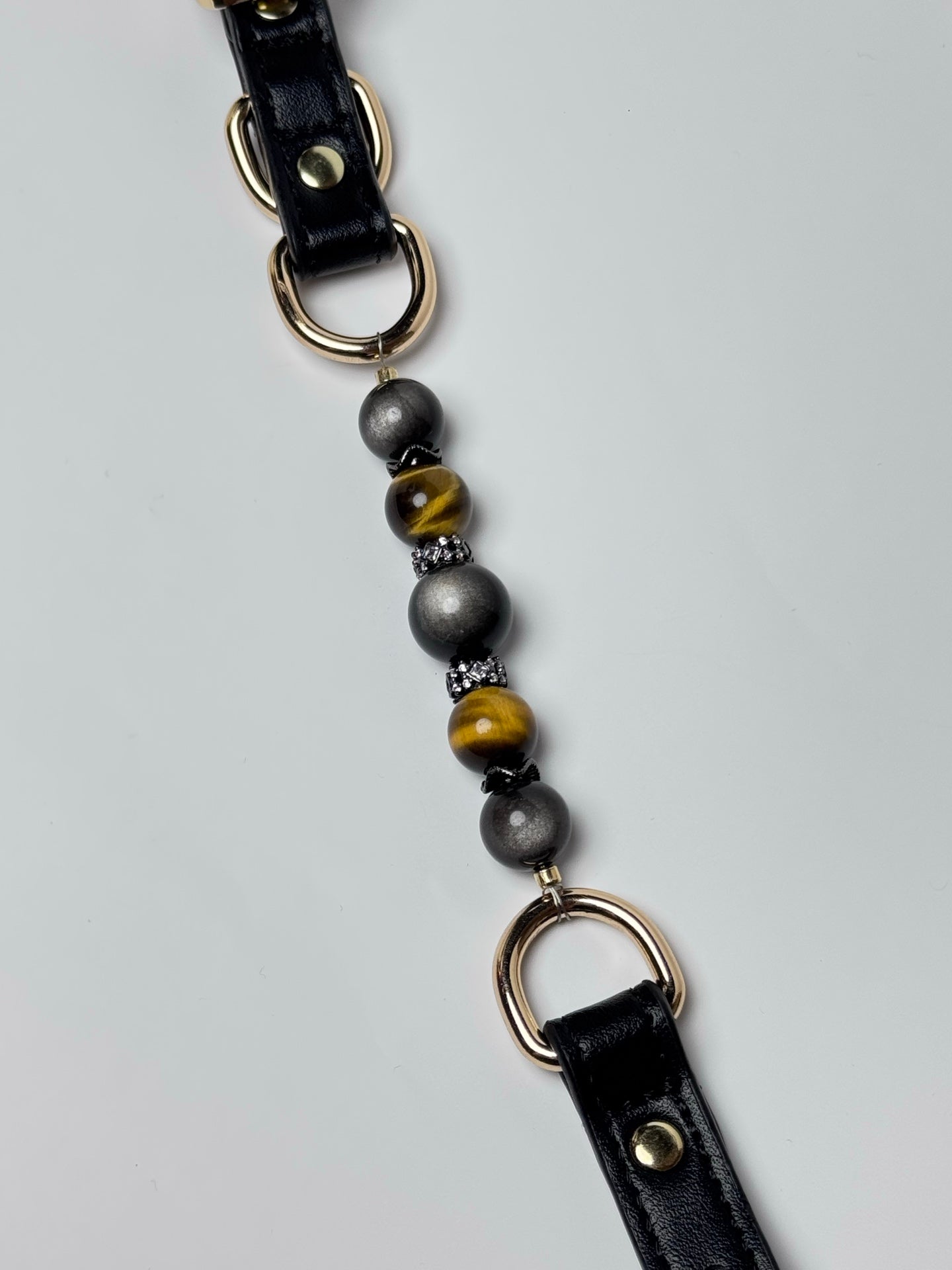 Double cats eye silver obsidian and tiger eye gemstone collar detail