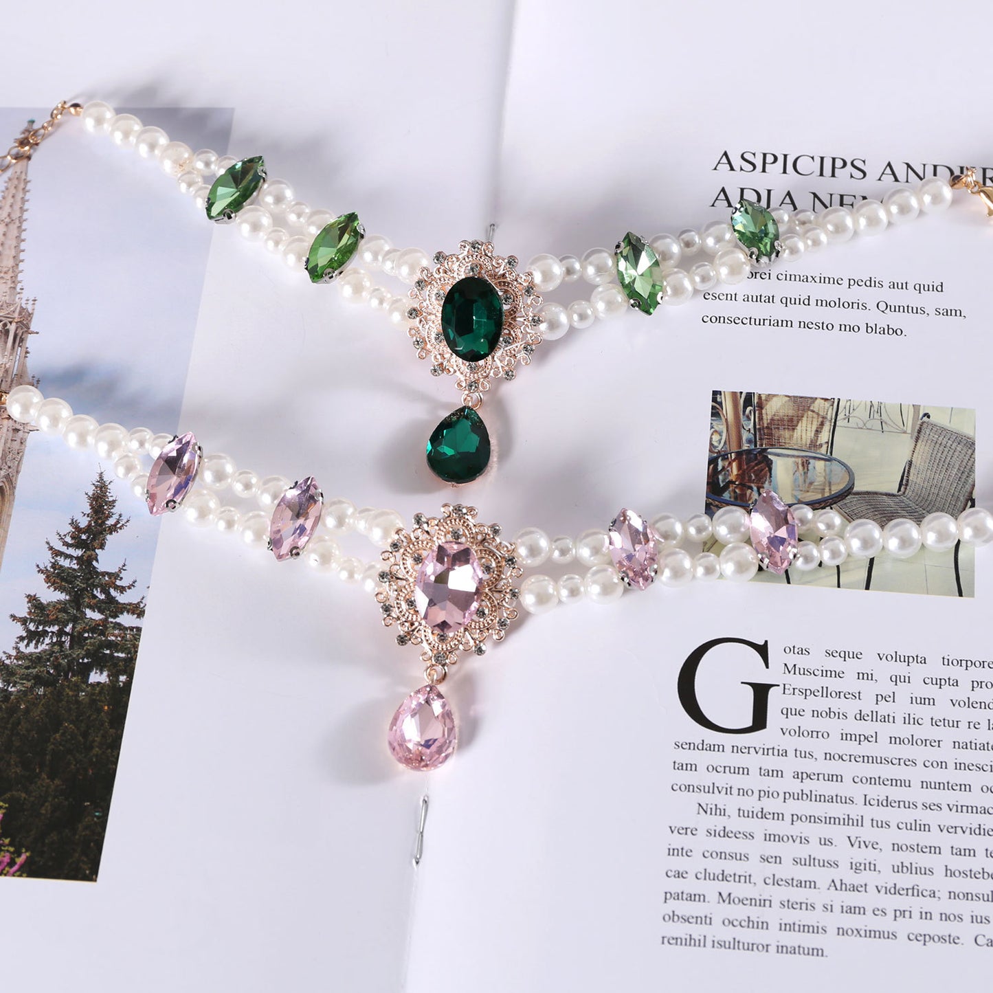 Green and pink pearl gem pet necklaces styled on a magazine